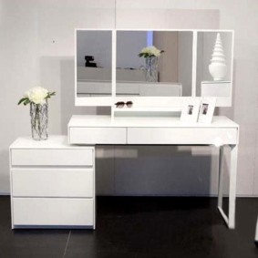 Stylish dressing table with a white bedside table