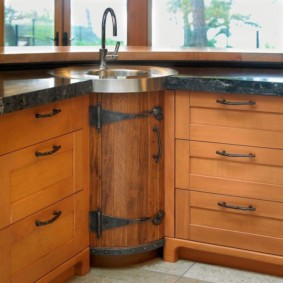 Stylish barrel door on the kitchen cabinet