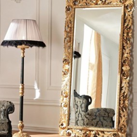 Gold-plated frame on the floor mirror