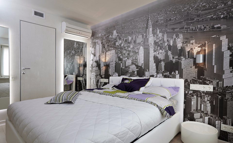 Simple bedroom with wall murals on the wall