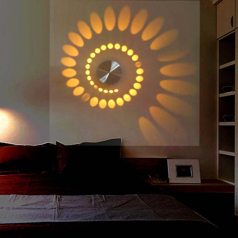 Designer lamp on the bedroom wall