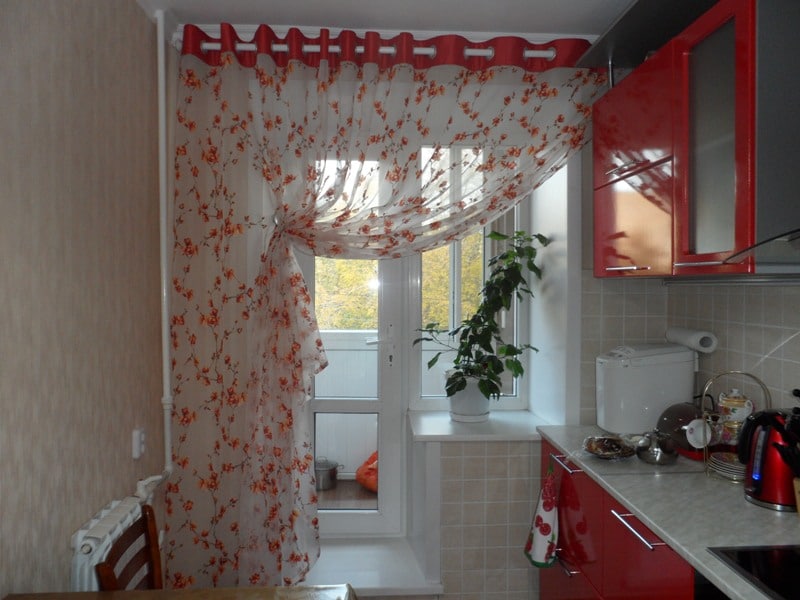 Tulle curtain in the kitchen with balcony