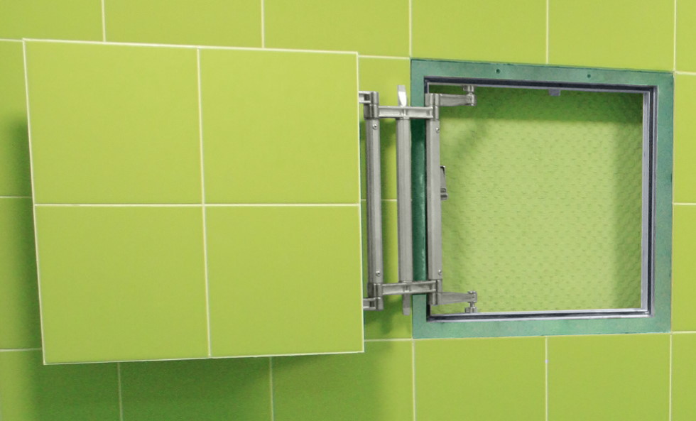 Light green tile on the door of the inspection hatch
