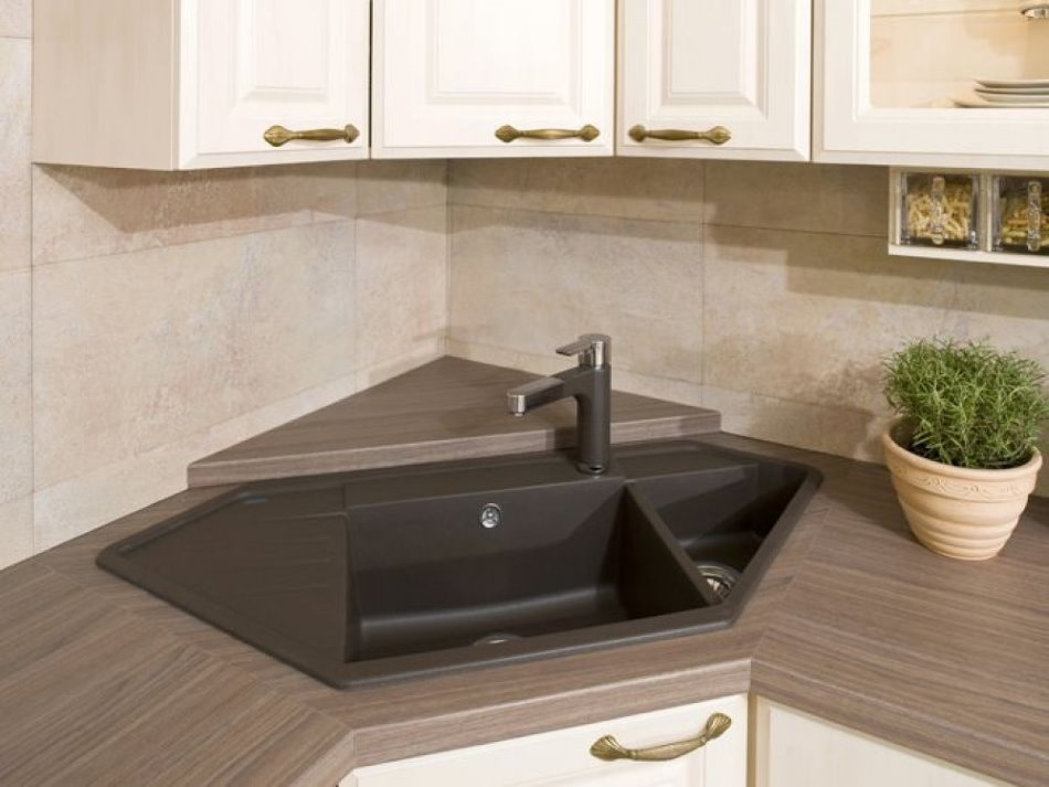 Trapezoidal sink in the corner of the kitchen set