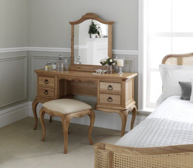 Wooden dressing table in a bright bedroom