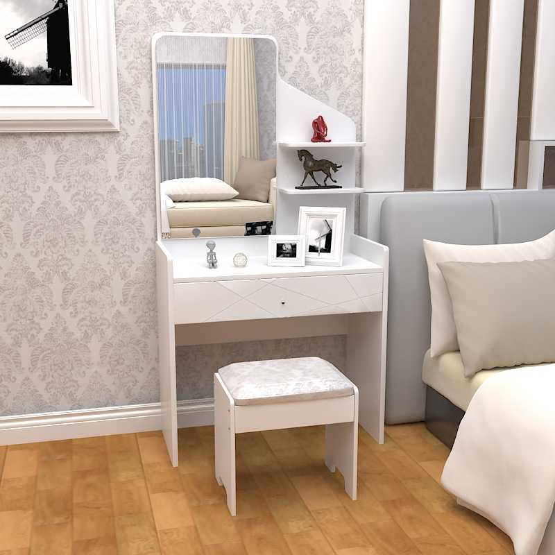 A small dressing table near the bed