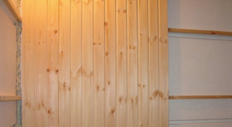 Wooden panels on the wall with a crate