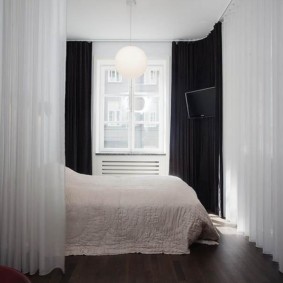 White curtains in the sleeping area