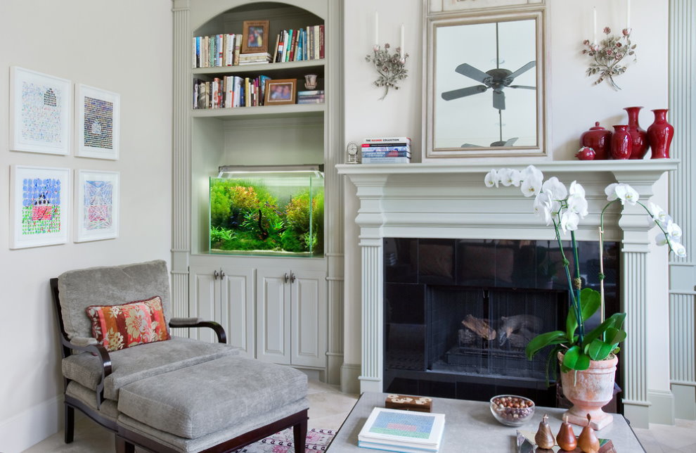 Decorative aquarium in the interior of a bright living room