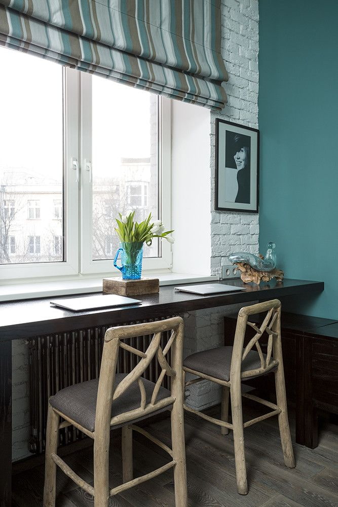 Bar stools in front of a windowsill table