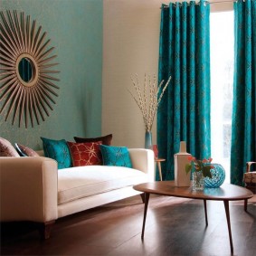 Turquoise curtains on a high window