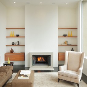 Open wooden shelves on the wall near the fireplace