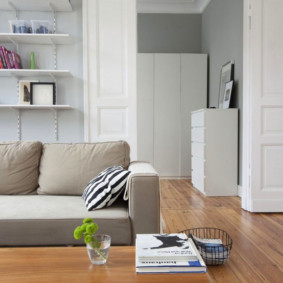 White doors in the living room with laminate