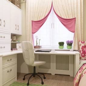 Double-sided curtains on the window of a room for a girl