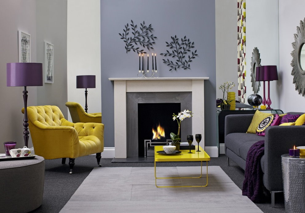 Yellow armchair in the hall with a decorative fireplace