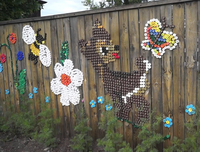 Decorating an old fence with plastic plugs