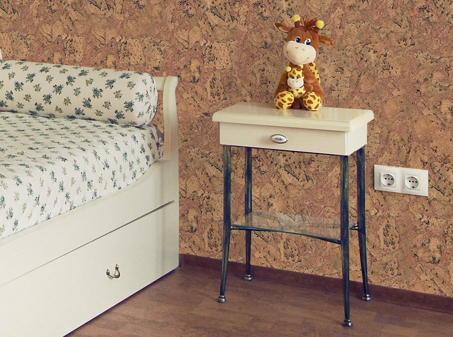 bedside table on the background of cork wallpaper