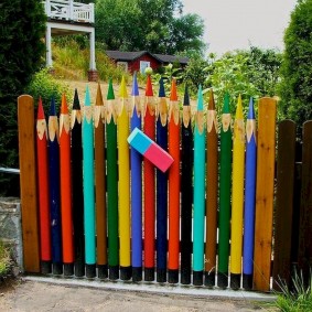 Garden fence in the form of colored pencils
