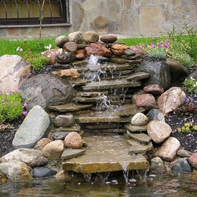 Stone waterfall in a summer cottage