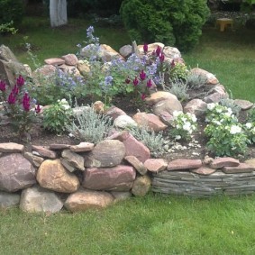 Rock garden made of natural stones in the countryside