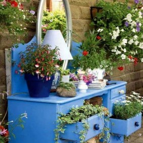 An old wardrobe as a flower bed