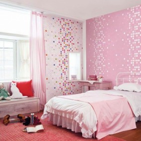 Pink wallpaper in the bedroom of a schoolgirl