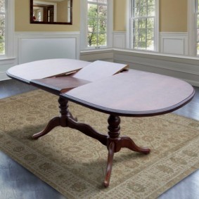 Folding dining table with curly legs