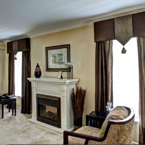 Curtains with pelmet in the hall with a fireplace