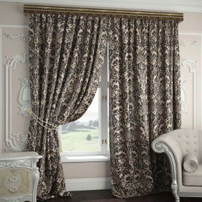 Dark monograms on curtains made of natural fabric
