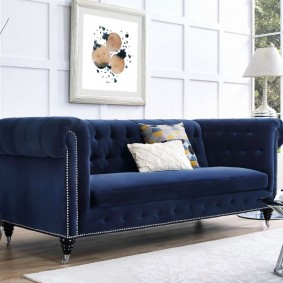 Blue sofa on thin legs