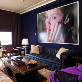 Large portrait over the sofa in the hall