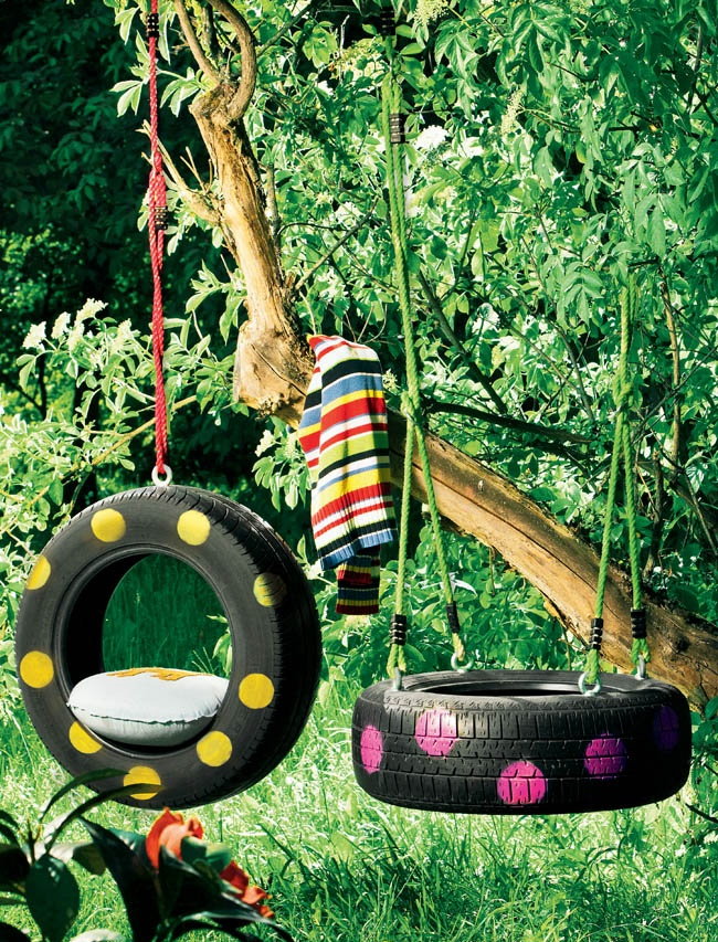 Children's swing from tires on a country site