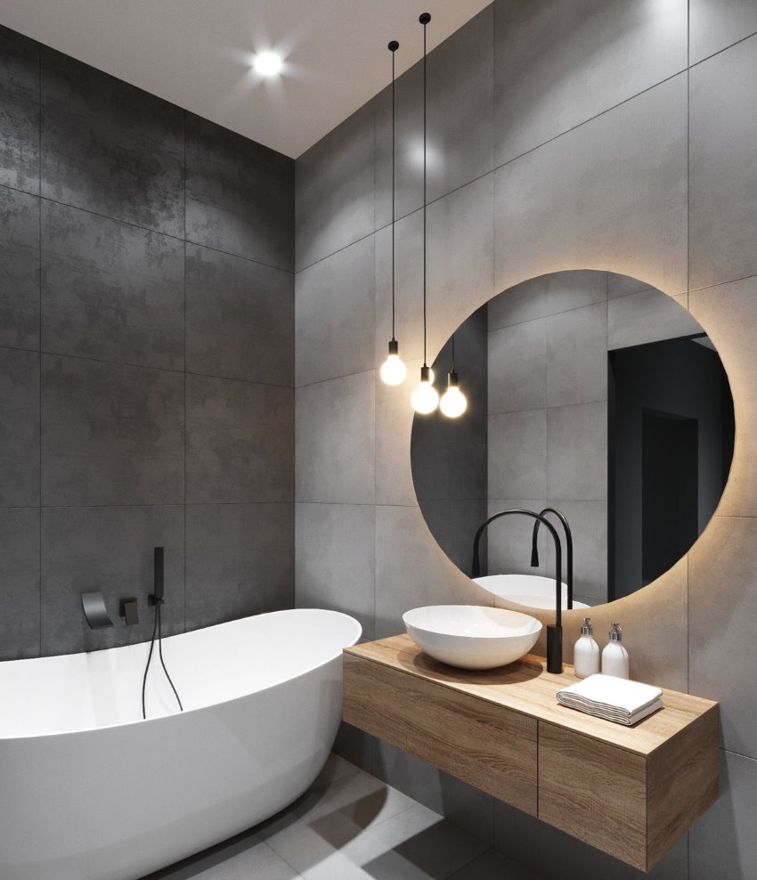 Round mirror in a compact modern style bathtub