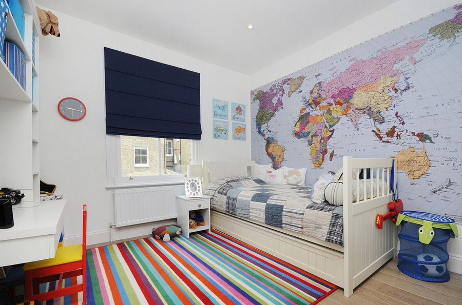 Wallpaper with a map in the bedroom of a schoolboy boy