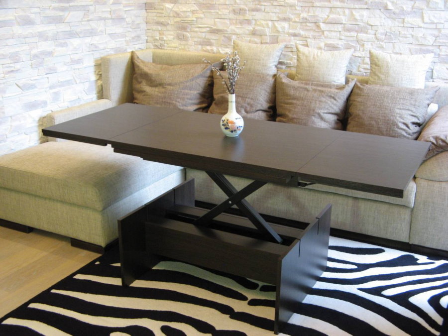 Folding table in front of the corner sofa in the hall