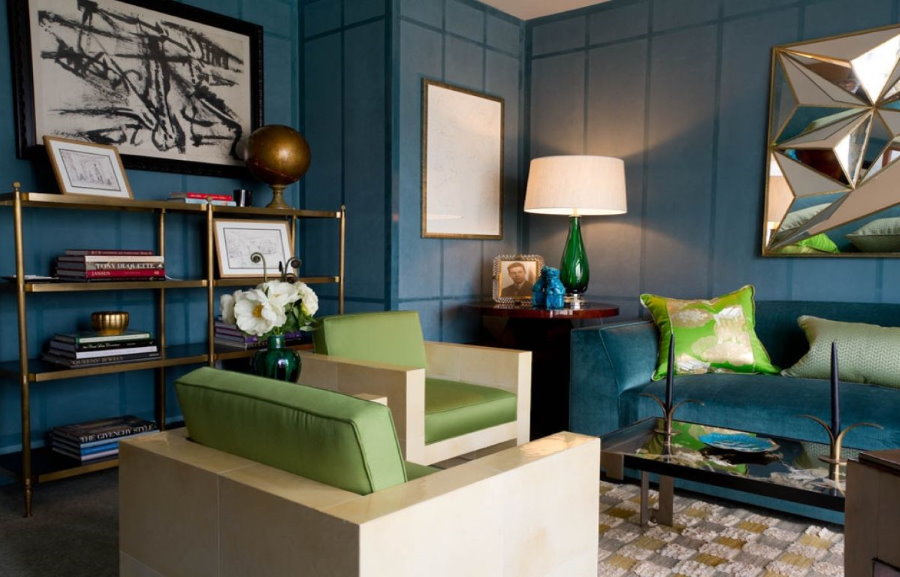 The combination of a blue sofa with green accents