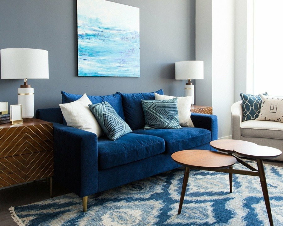 Living room wall decoration over blue sofa