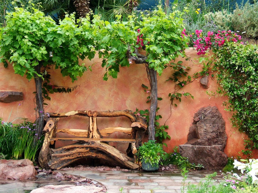 Homemade wooden bench near the wall of the barn