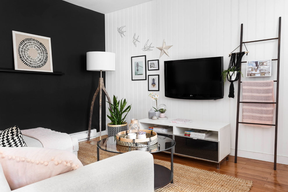 Design noir et blanc d'une chambre dans un appartement