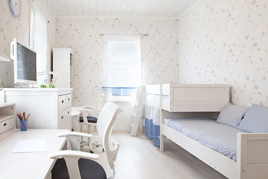 White furniture in the bedroom for two children