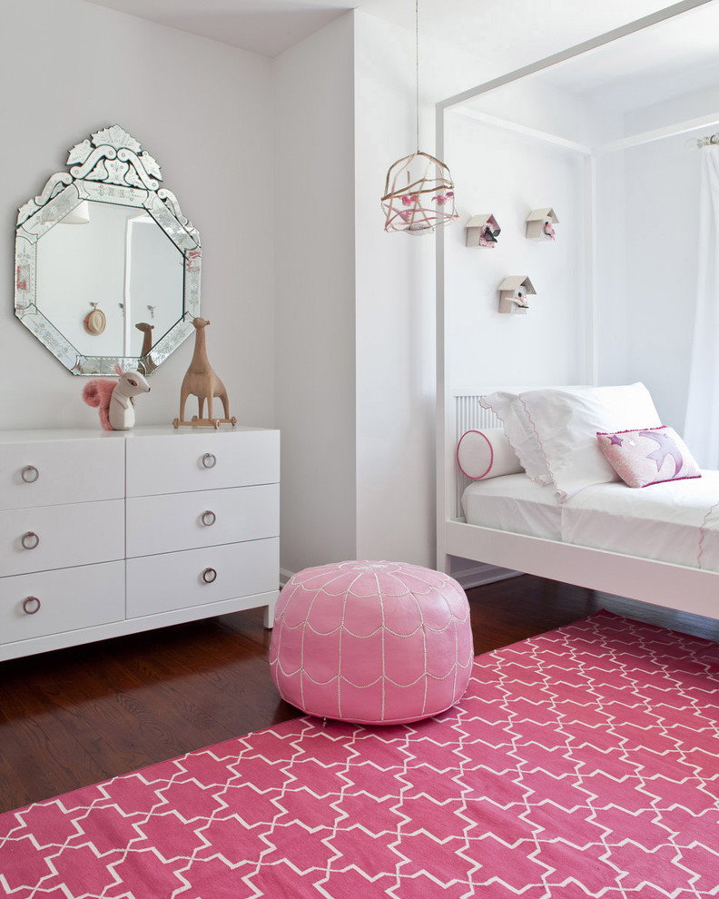 Pink carpet in a room with a white dresser