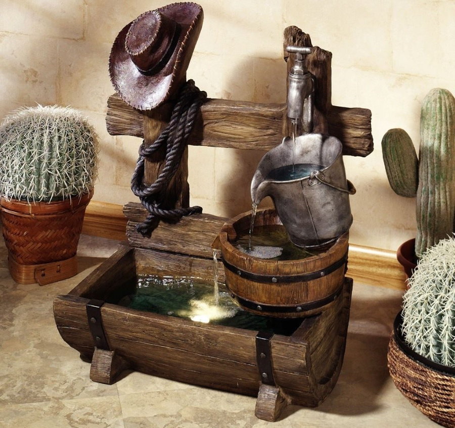 Wooden decorative fountain on a table in the hall