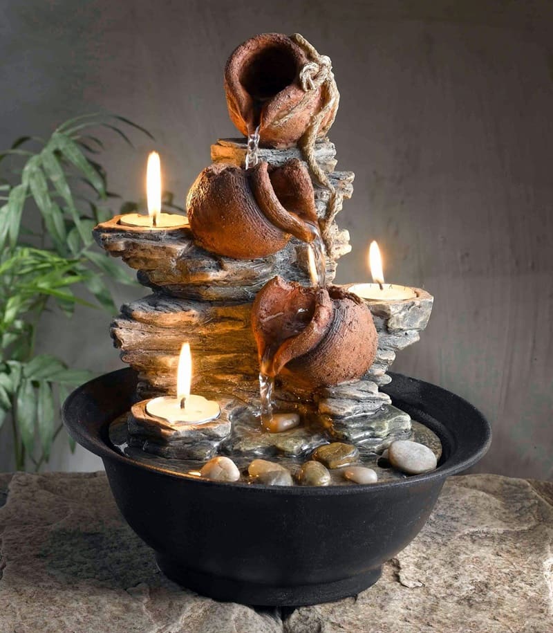 Decorative stone fountain with candles