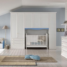 White wardrobes in a newborn's bedroom