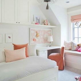 Bright children's room in the attic of the house