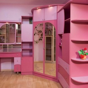 Pink furniture in the room of a young fashionista