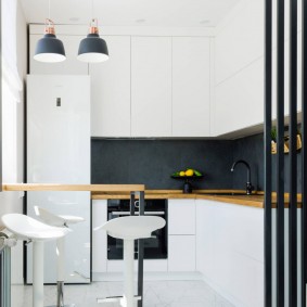 Black apron in a white kitchen