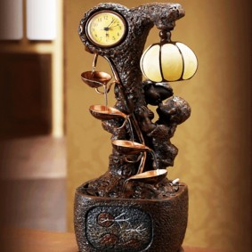 Table decorative fountain with a clock