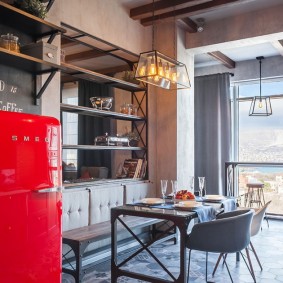 Red refrigerator in the loft style kitchen