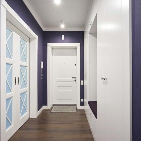 White door at the end of the corridor